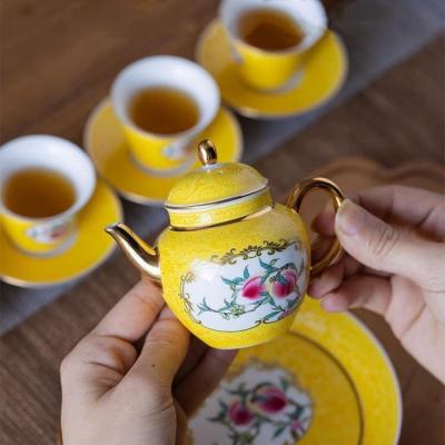BỘ ẤM CHÉN QUẢ ĐÀO MEN VÀNG
